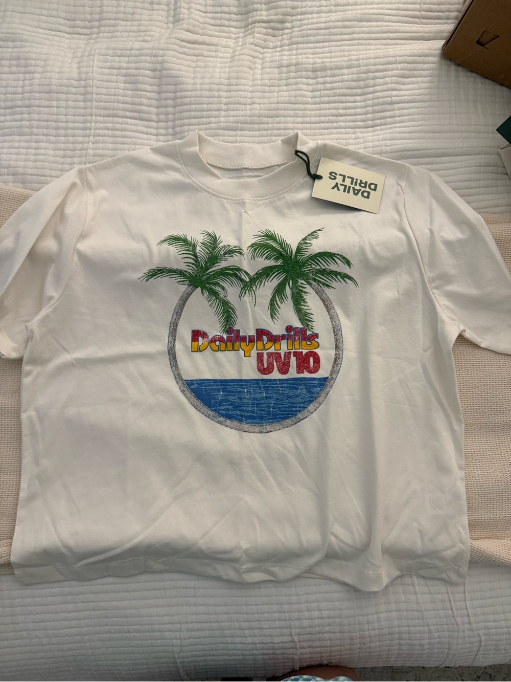 Daily Drills White Tee with Tropical Palm & Ocean Graphic